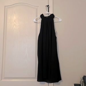 Black sleeveless dress.